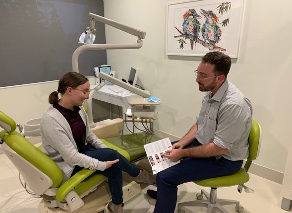 Foundation Dental Services specialist periodontist explaining the dental implnat process to patient