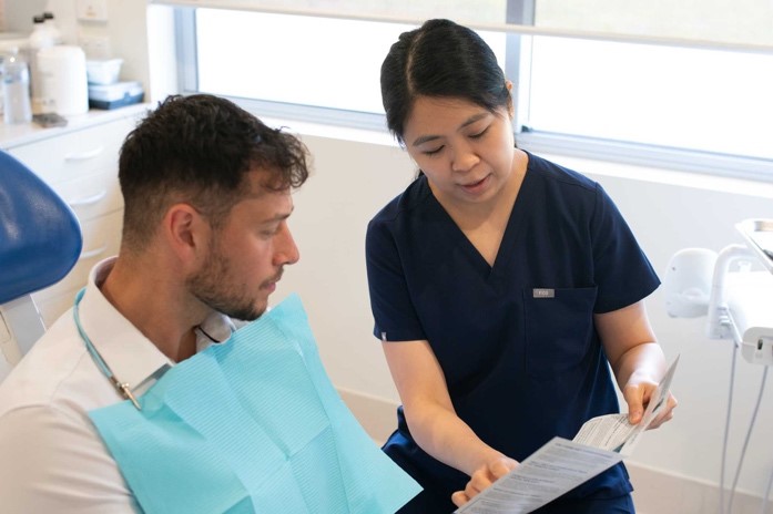 Foundation Dental Services specialist periodontist explaining the treatment to the patient